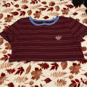 Tight fitting cropped cherry top.